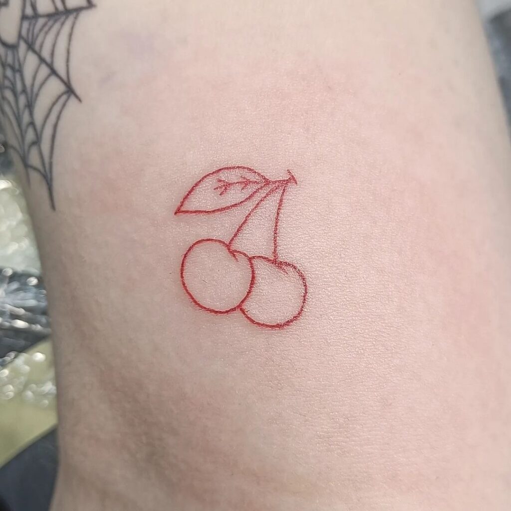 small red cherry tattoo for women