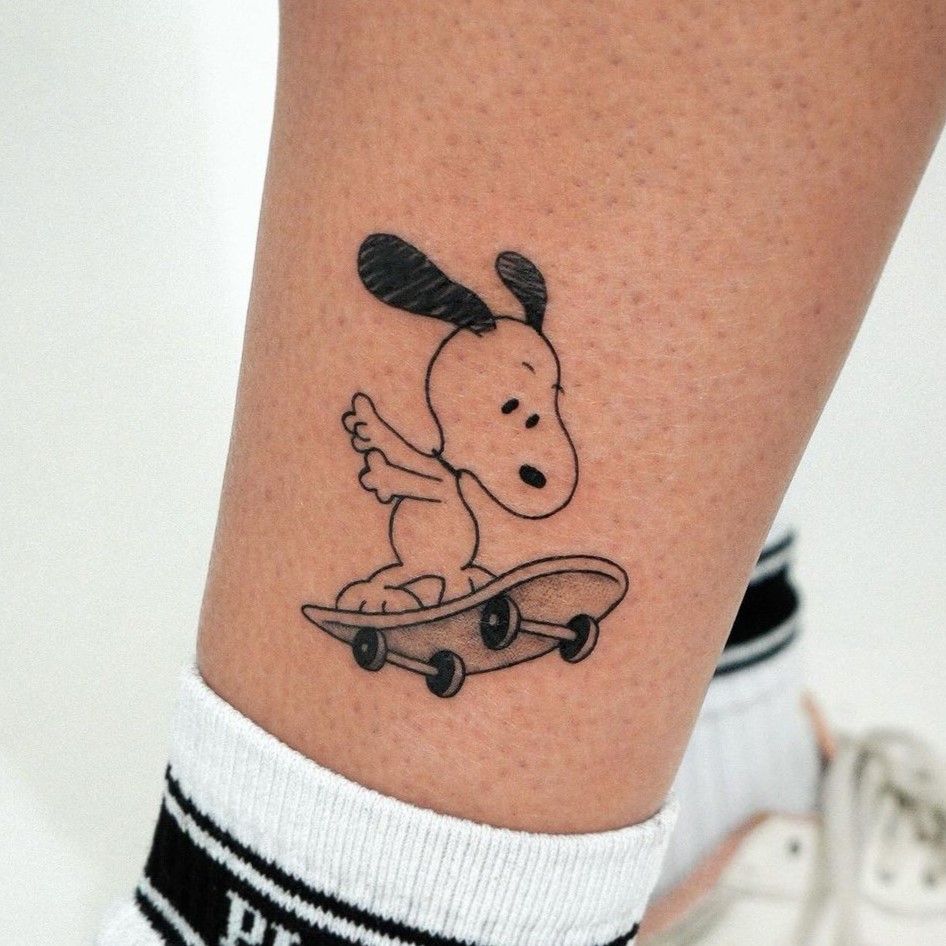 skating snoopy tattoo