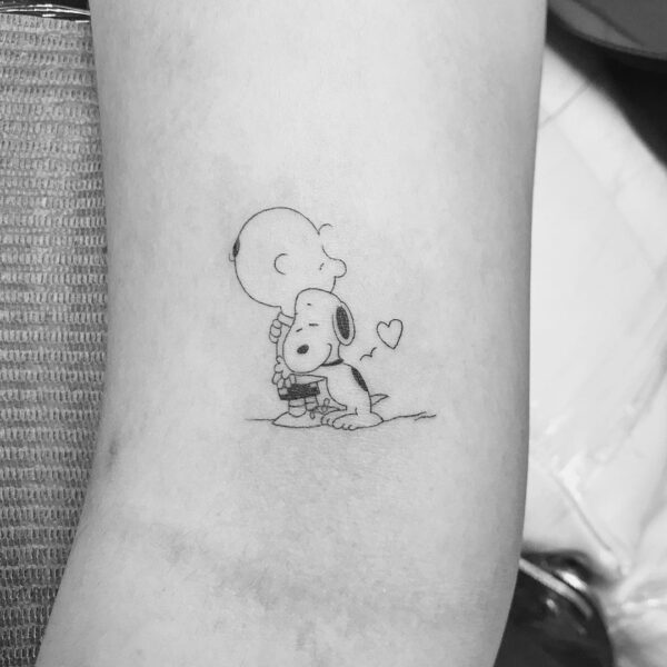 Snoopy Tattoo Ideas for Women: Unique, Charming and Adorable - Blissful ...