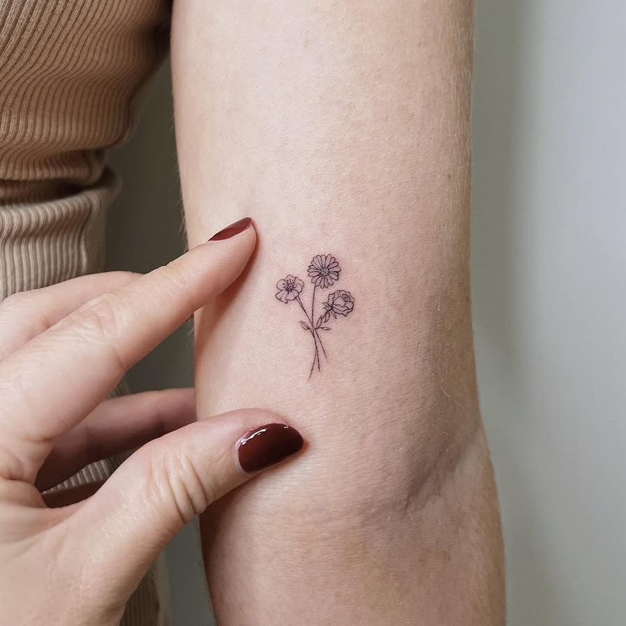 tiny floral tattoo for women